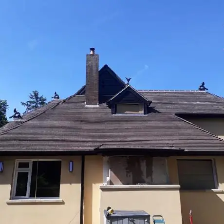 Roofing in Ashton-in-Makerfield: detached house with a newly tiled roof