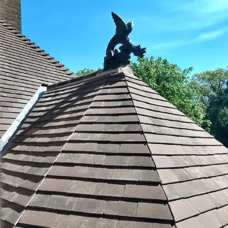 Roofing in Standish: hip roof with a decorative finial after re-roofing