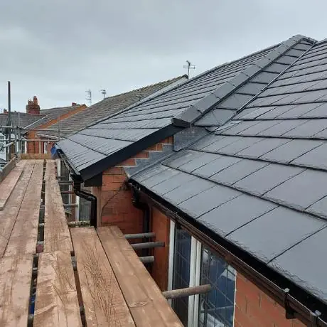 Roofing near Standish: new tiled roof and dormer seen from the scaffold