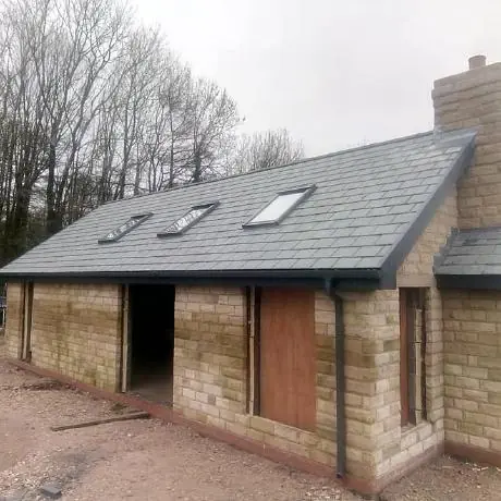 Roofing in Billinge: stone building finished with a new slate roof and roof windows