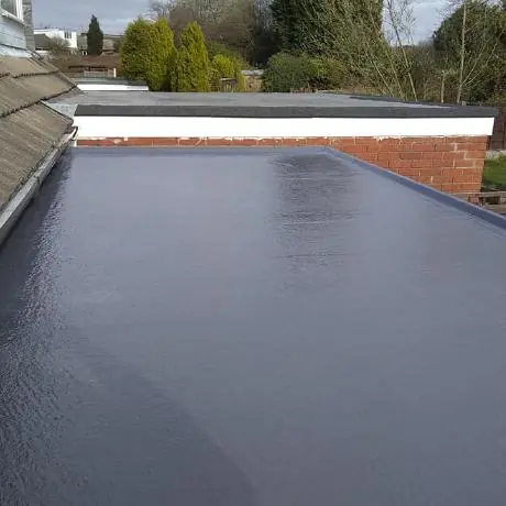 new flat roof surface finished with a neat edge trim