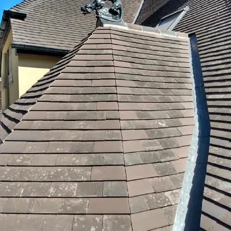 Roofing near Chorley: tiled hip with a decorative finial and lead work