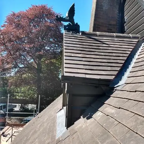 Roofing near Standish: lead valley beside a tiled dormer