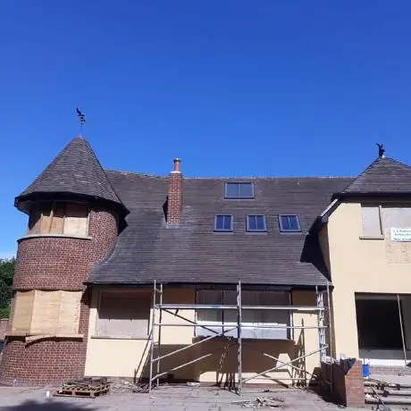 Roofing near Chorley: detached house with a turret roof during re-roofing