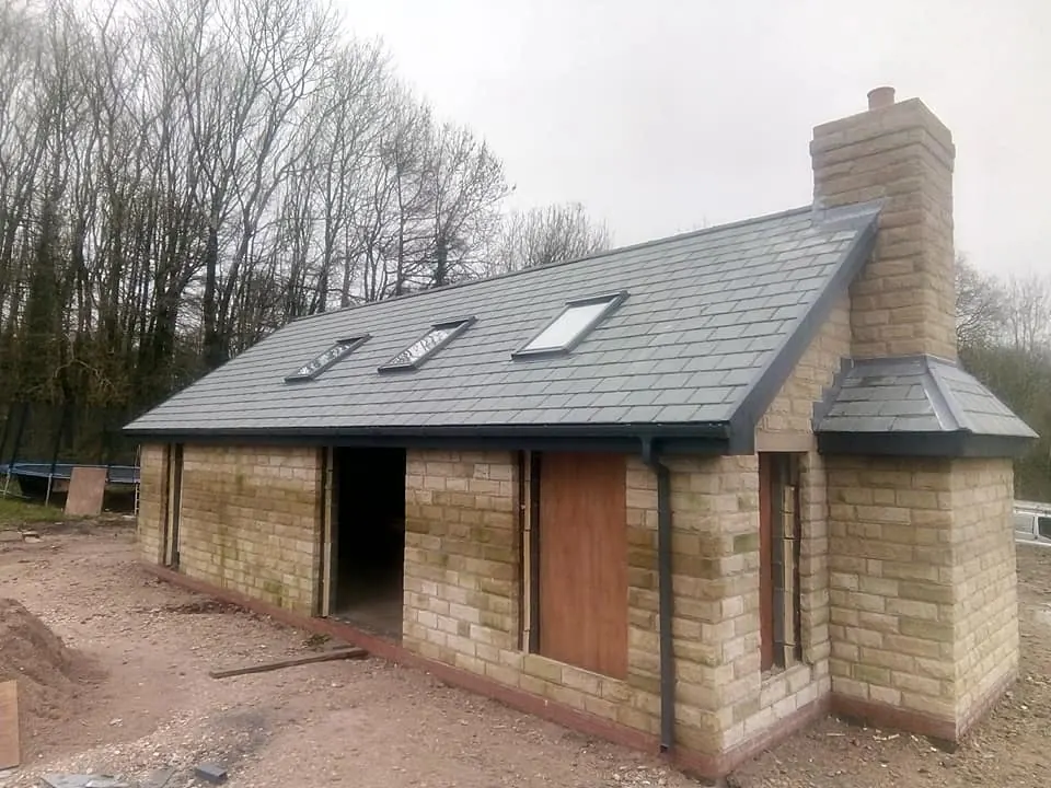 Stone extension with a new slate roof in Lancashire
